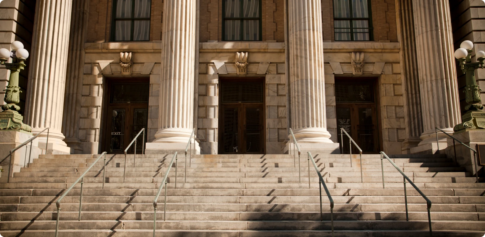 Grand stairs leading to building entrance.